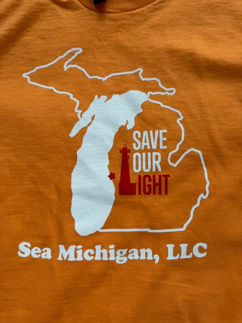 Orange shirt with a map of Michigan and text 'Save Our Light' and 'Sea Michigan, LLC'.