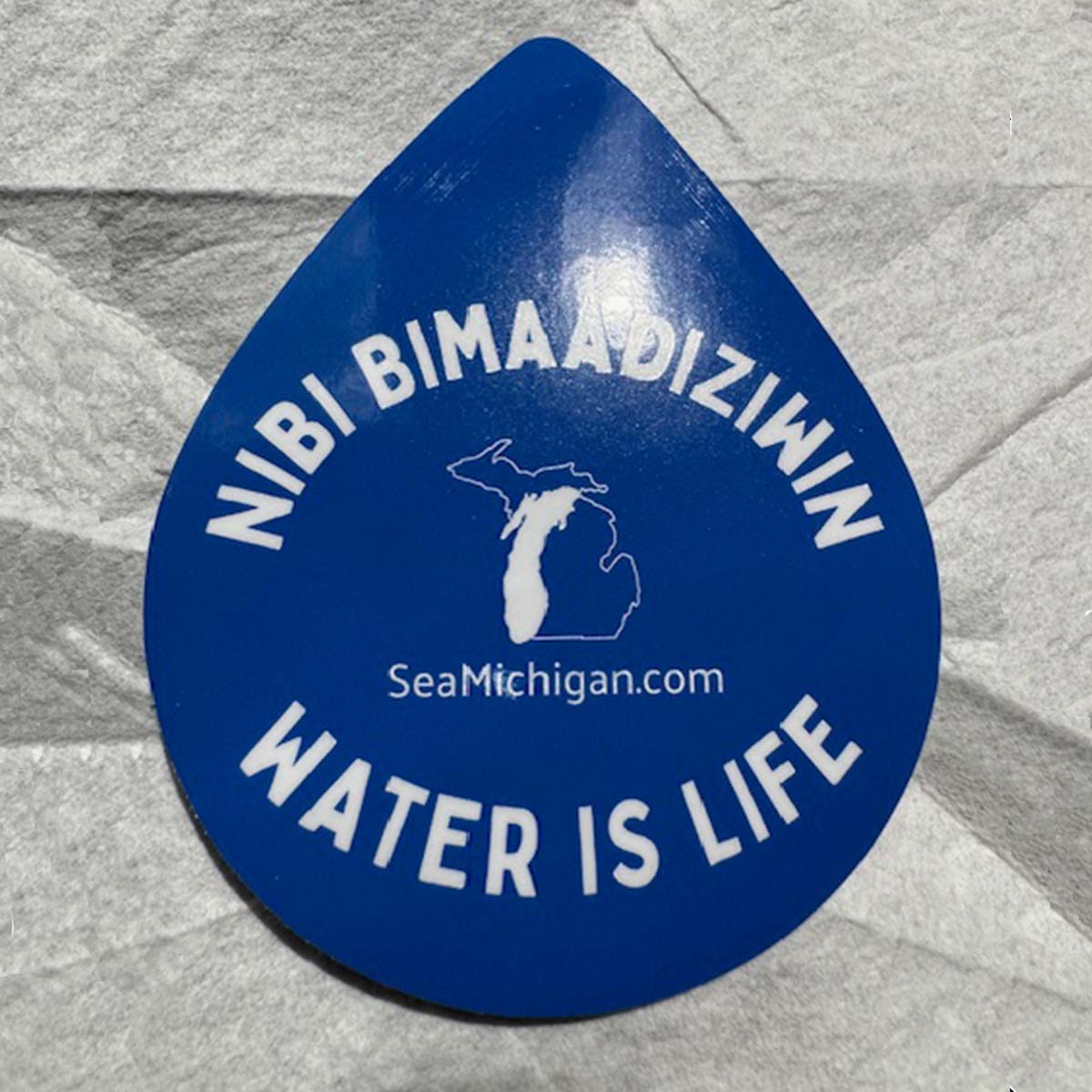 blue teardrop shaped decal - ninibimaadiziwin water is life seamichigan.com